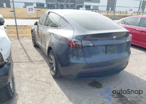 2023 Tesla Model Y Rwd из США, поврежденный, VIN 7SAYGDED9PF958702